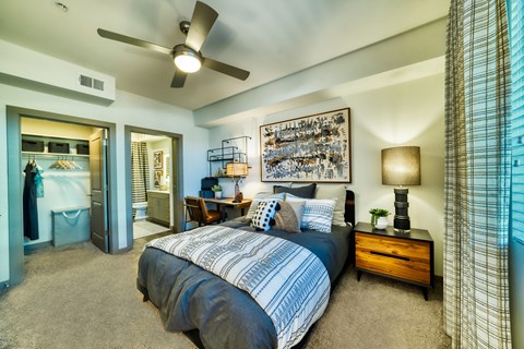 a bedroom with a bed and a ceiling fan at Elevation at the Village, Arizona, 85295