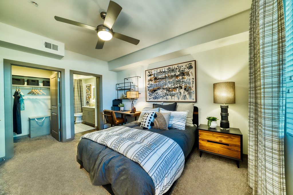 a bedroom with a bed and a ceiling fan a bedroom with a bed and a ceiling fan at Elevation at the Village, Arizona, 85295