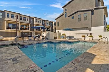 A swimming pool with a no-swimming sign on the edge.