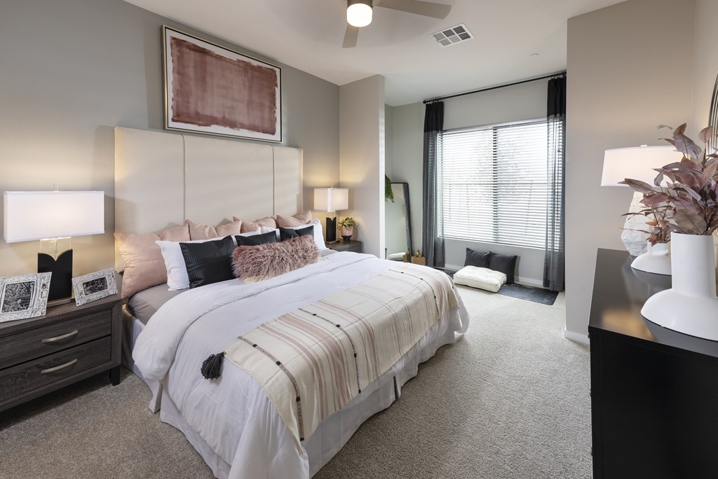 Icon at Cooley Station- apartment master  bedroom with a large bed and a window