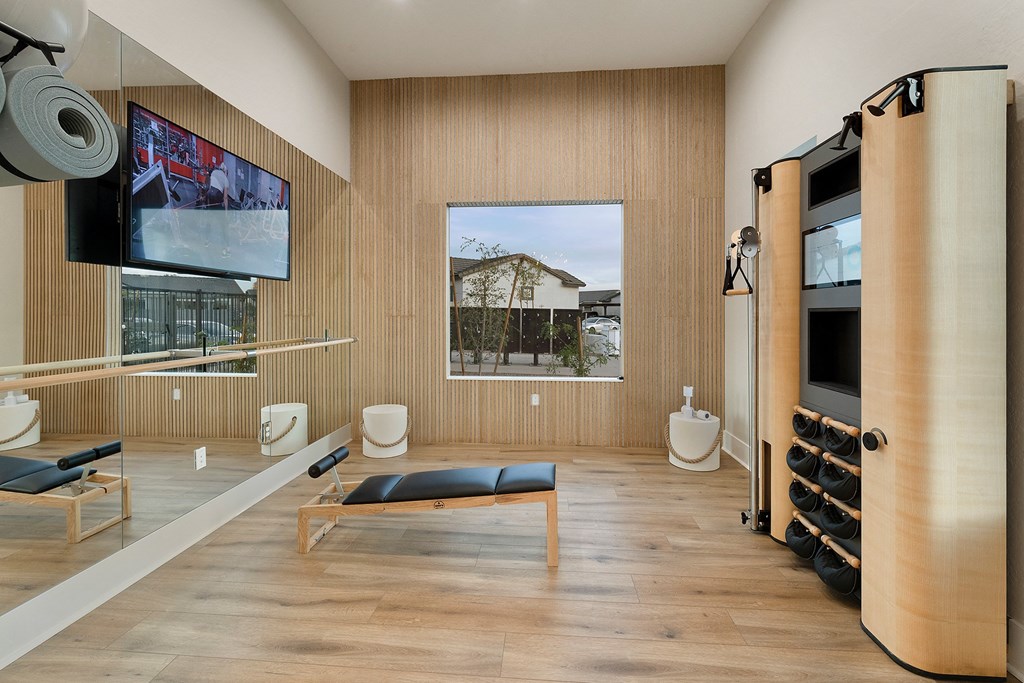 a living room with a couch and a tv on the wall