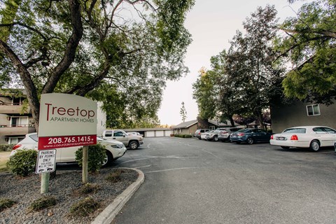 the parking lot at tree top apartments