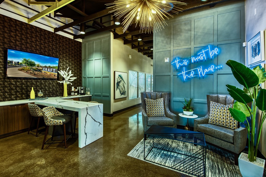 A room with a neon sign that says