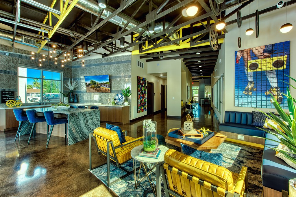 A room with a yellow chair and a blue chair.