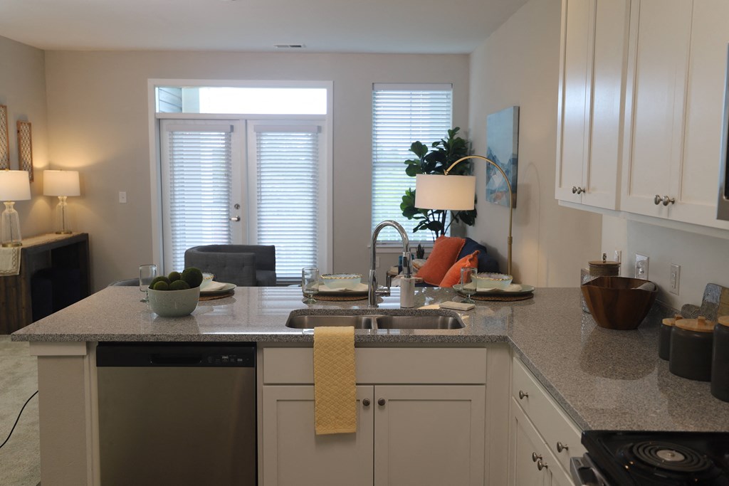 1 bedroom decorated model kitchen with view of living room