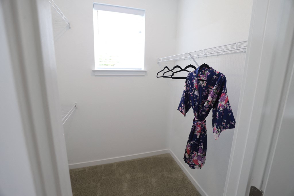 2 bedroom decorated model master walk in closet