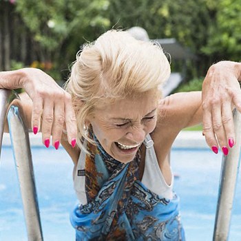 Woman enjoys an outdoor pool Property Image