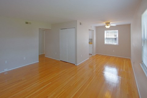 A room with wooden floors and white walls.