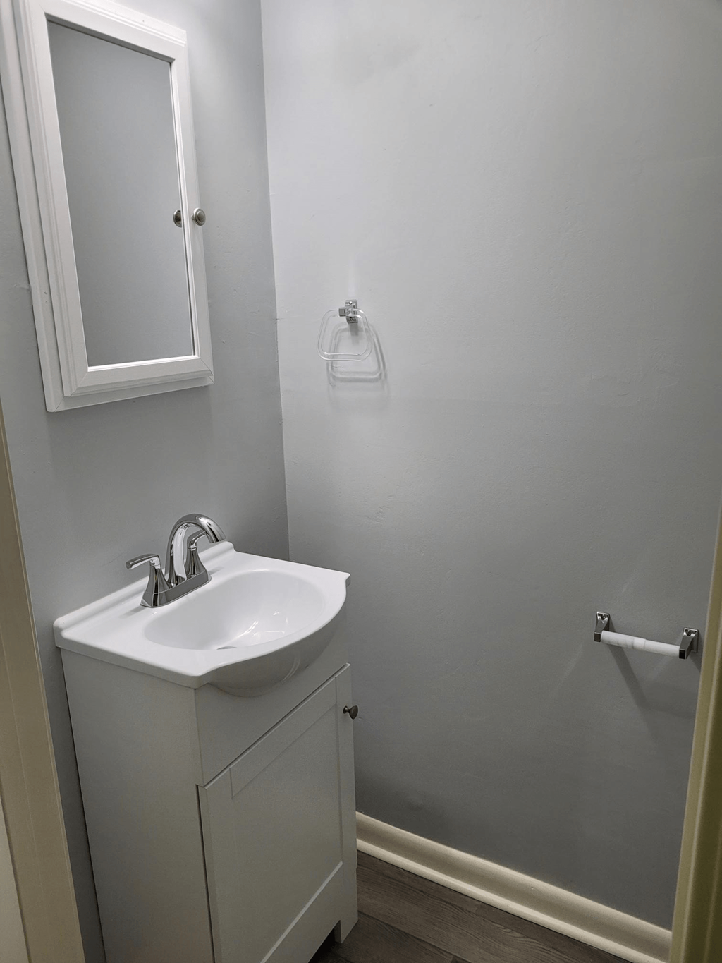a small bathroom with a sink and a mirror