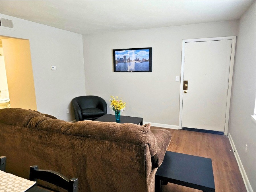 a living room with a couch and a table and a tv
