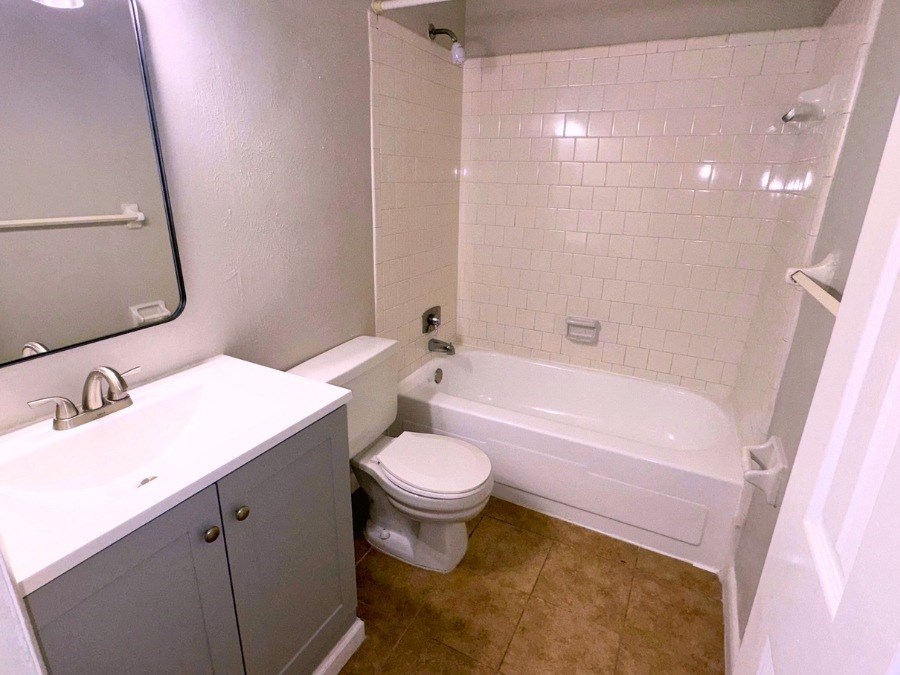 a bathroom with a sink toilet and a tub