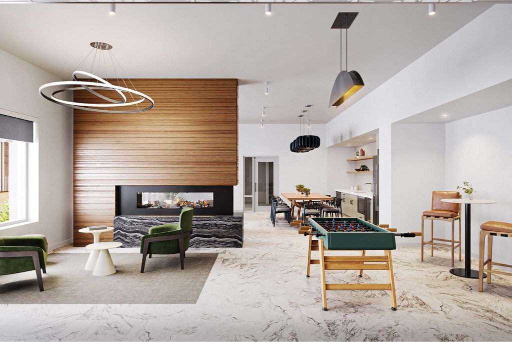 a living room with a pool table and a fireplace at Link Apartments® Calyx, Chapel Hill, NC