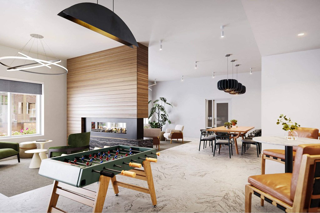 a living room with a pool table and a dining room at Link Apartments® Calyx, Chapel Hill, 27517
