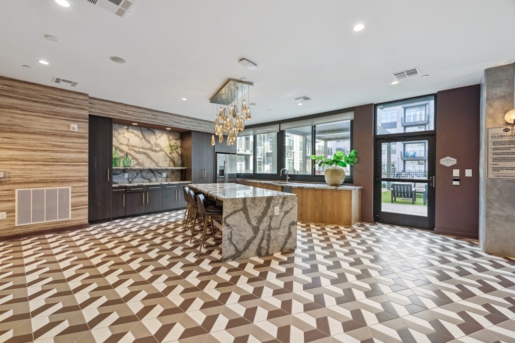 the lobby of a hotel with a marble bar and a checkered floor