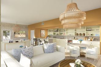 a living room filled with furniture and a large chandelier  at Link Apartments® Mixson, North Charleston, SC