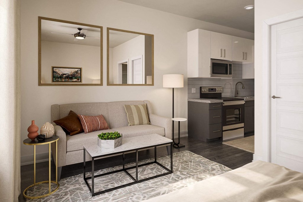 a living room with a couch and a table at Link Apartments® Calyx, Chapel Hill, NC