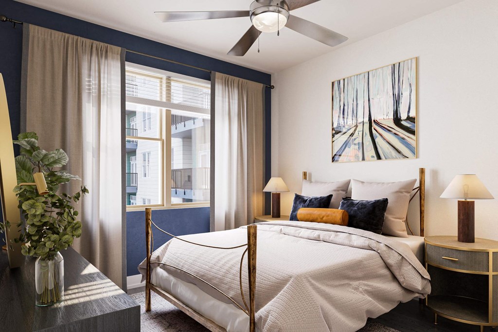 a bedroom with a bed and a ceiling fan at Link Apartments® Calyx, Chapel Hill North Carolina