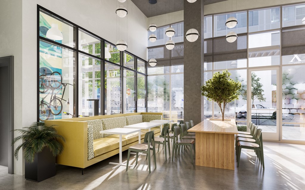 a dining room with tables and chairs and large windows