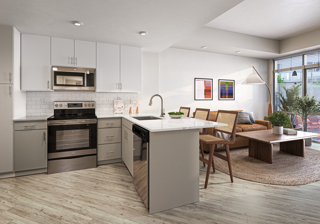 a kitchen and living room with an island and a dining room table