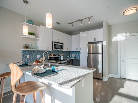 Fitted Kitchen With Island Dining at Link Apartments® Glenwood South, Raleigh, NC, 27603