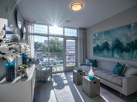 Living Room With Expansive Window at Link Apartments® Glenwood South, North Carolina, 27603