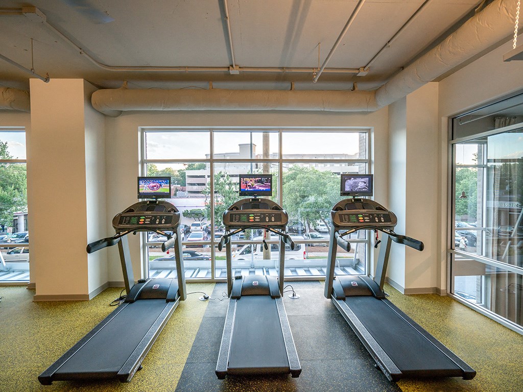 Cardio Machines In Gym at Link Apartments® Glenwood South, Raleigh, North Carolina
