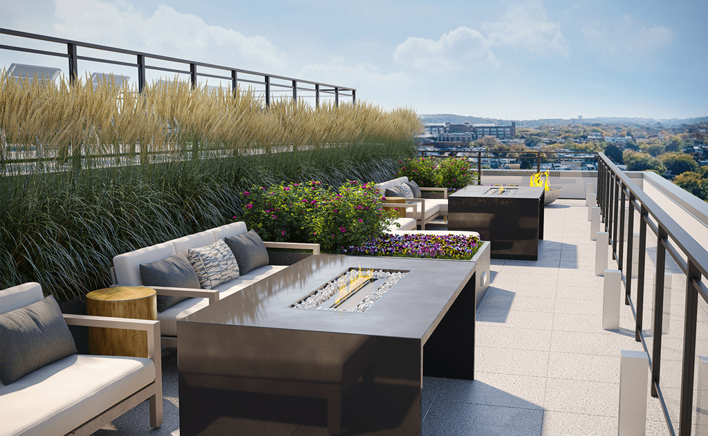 a roof top lounge with a view of the city at Link Apartments® H Street, Washington, Washington