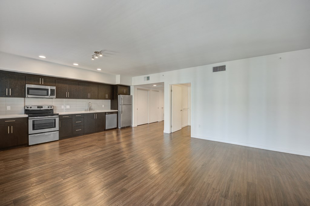 Kitchen with dark wood floors at 5550 Hollywood, Los Angeles, 90028