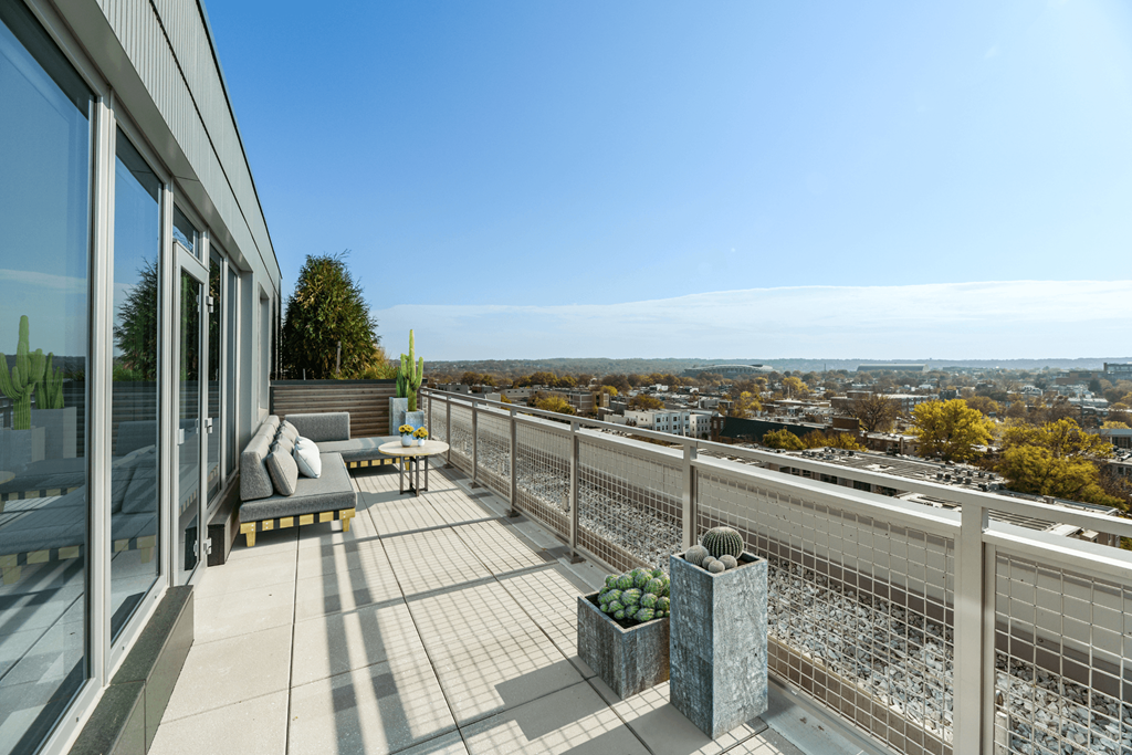 a view of the city from the balcony of a house  at Link Apartments® H Street, Washington, 20002
