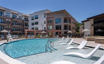 Poolside Relaxing Area at Link Apartments® Linden, North Carolina, 27517