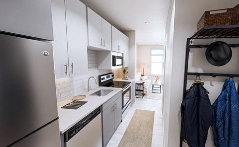 Designer studio floor plan with spacious kitchen and stackable washer/dryer in new Link Apartments 4th Street
