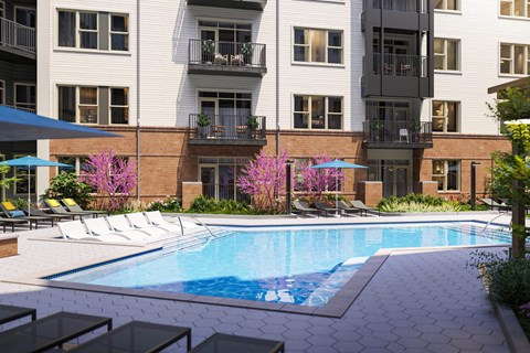 a large swimming pool in front of an apartment building at Link Apartments® Calyx, North Carolina, 27517