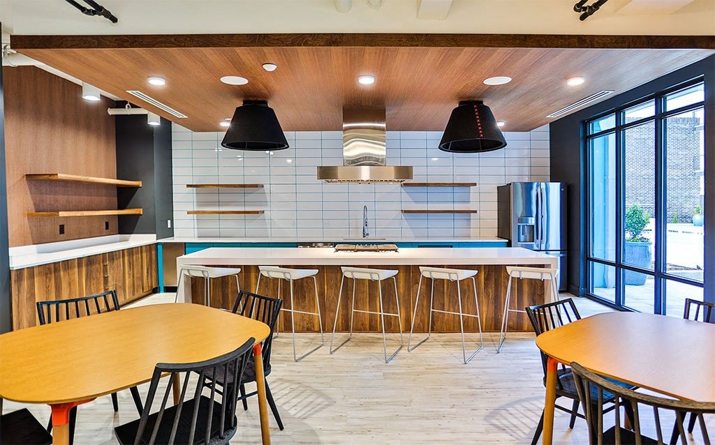 Clubhouse Kitchen Breakfast Bar with Stools at Link Apartments® Montford, Charlotte, NC