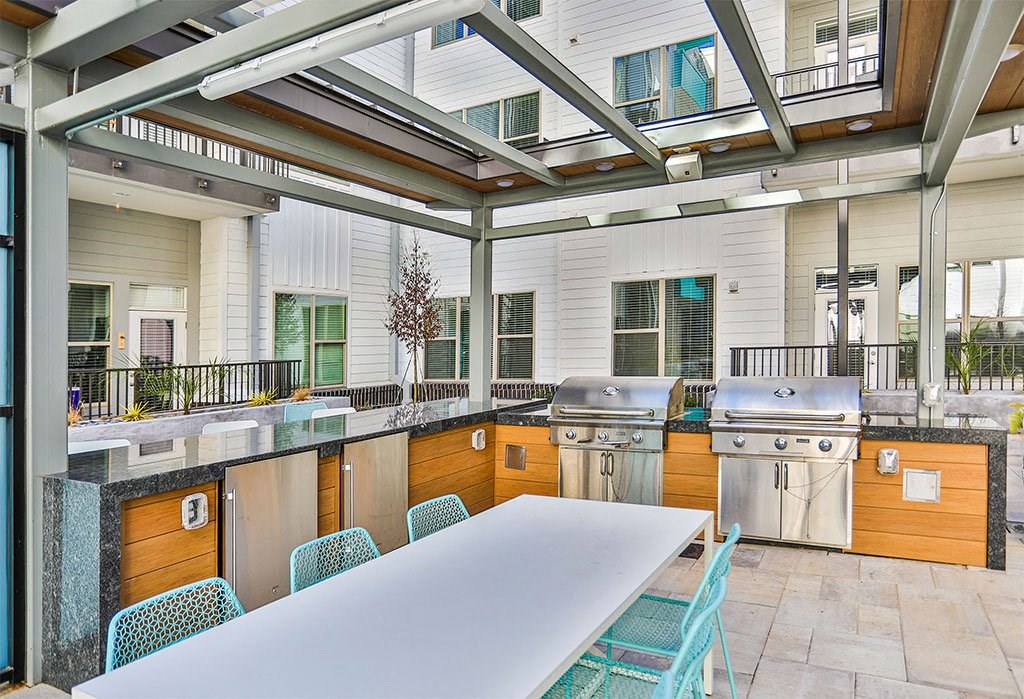 Outdoor Grill With Intimate Seating Area at Link Apartments® Montford, North Carolina