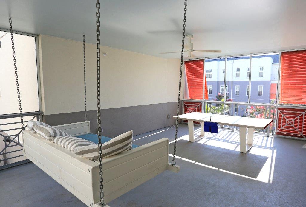 Unique porches and ping pong tables in Phase 1 at Link Apartments® Mixson, North Charleston, SC