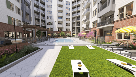 an outdoor lounge area with a pool and an apartment building