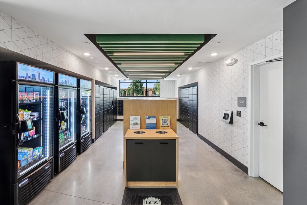 A long hallway with a black trash can in the middle at Link Apartments® CYKEL Apartments, Charlotte, North Carolina