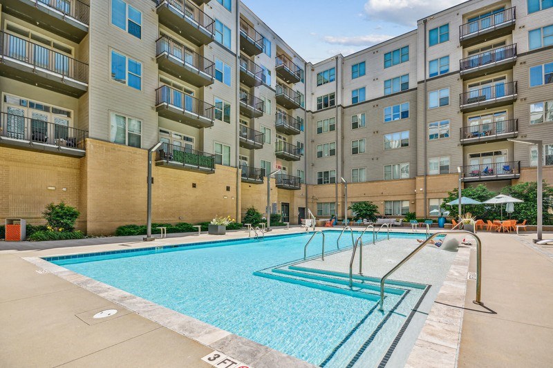 a swimming pool in front of an apartment building at Link Apartments Innovation Quarter, North Carolina