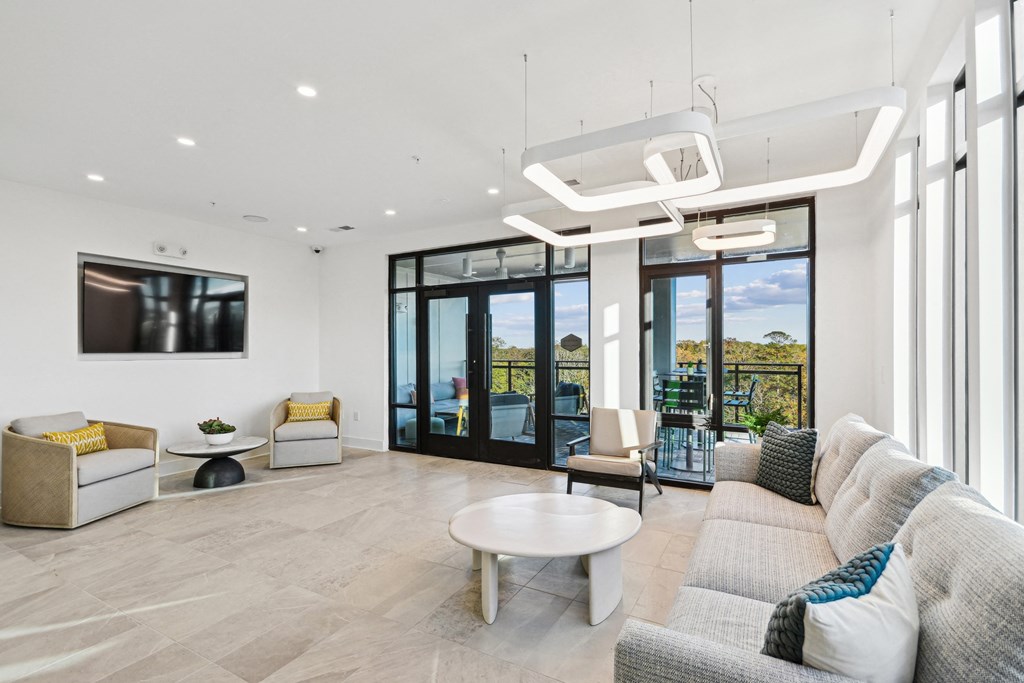 a living room with a couch and a coffee table at Link Apartments® Calyx, North Carolina, 27517