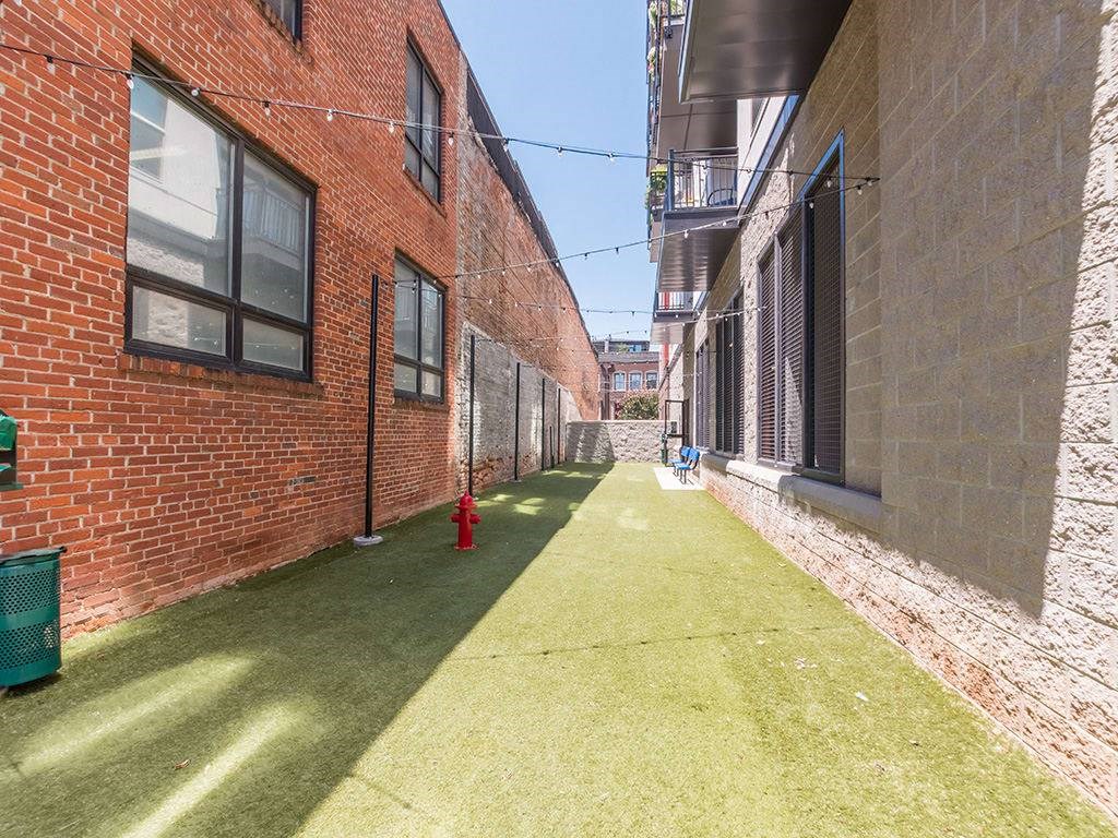 Courtyard With Green Space at Link Apartments® West End, South Carolina, 29601