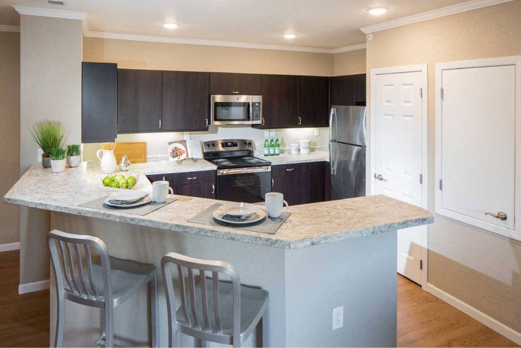 a kitchen with a marble counter top