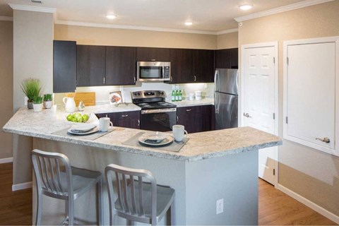 a kitchen with a marble counter top