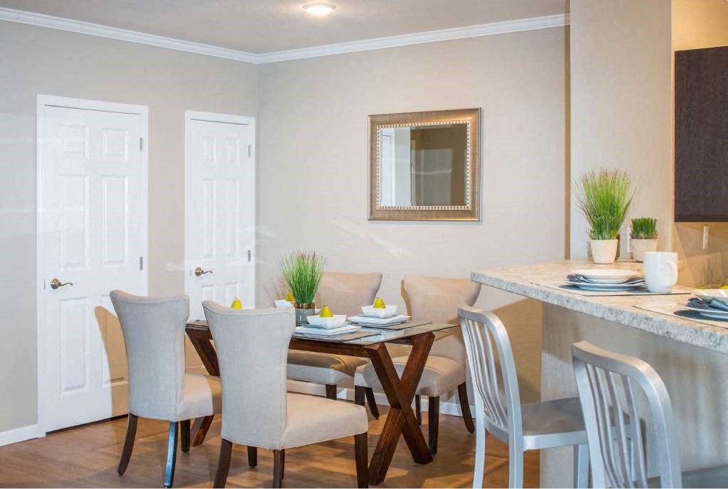 a dining room with a table and chairs