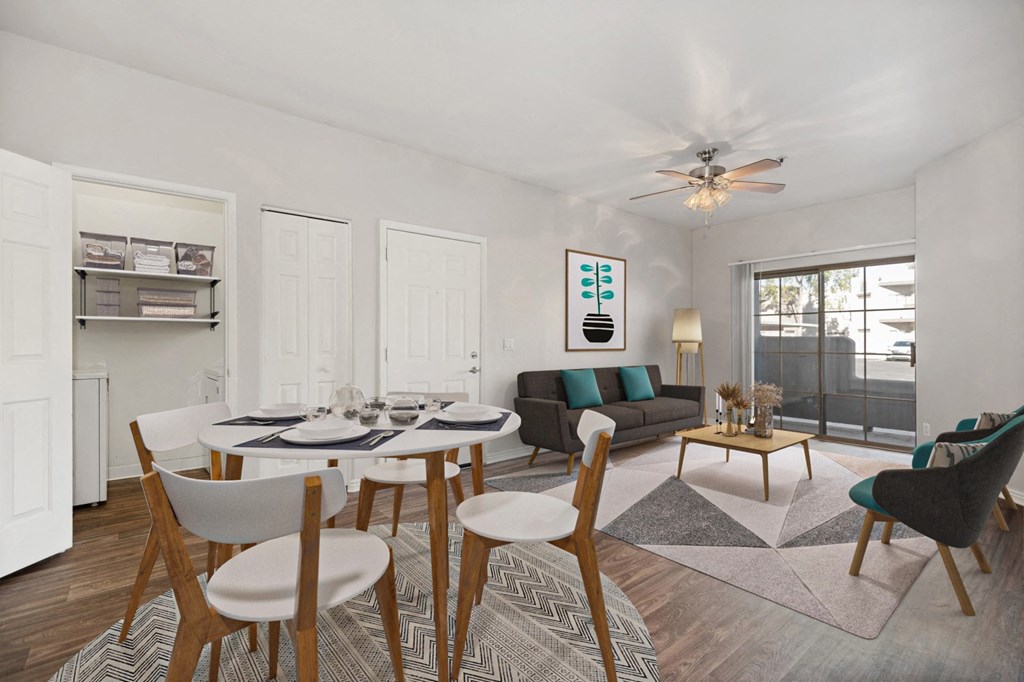 a living room with a dining room table and a couch