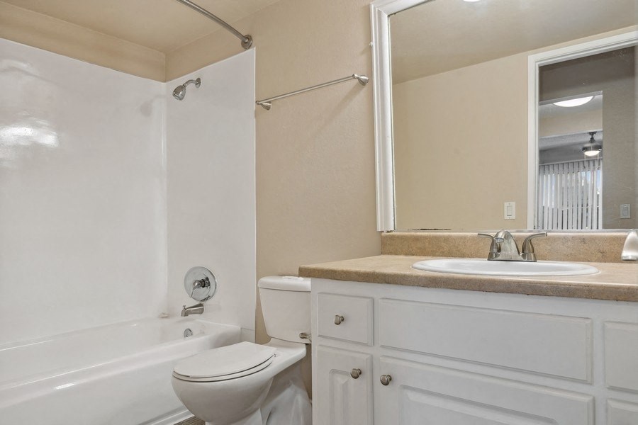 a bathroom with a sink toilet and a bath tub