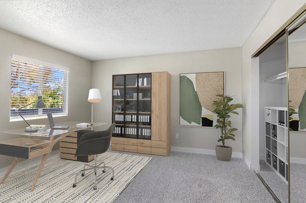 a home office with a desk and a window