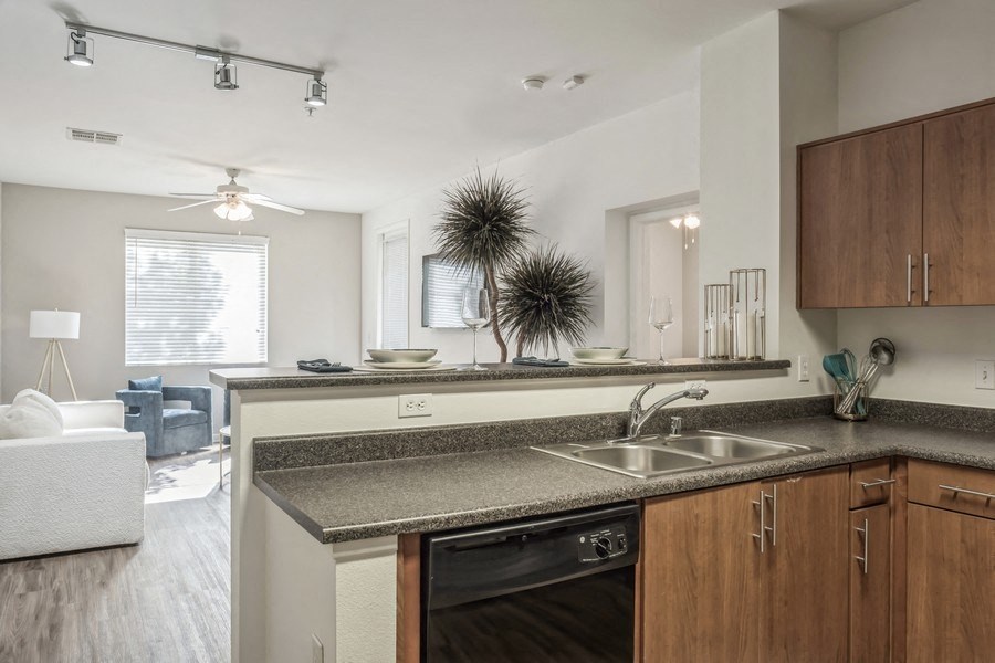 a kitchen with granite counter tops and a sink