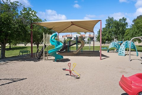 a playground with slides and a tent