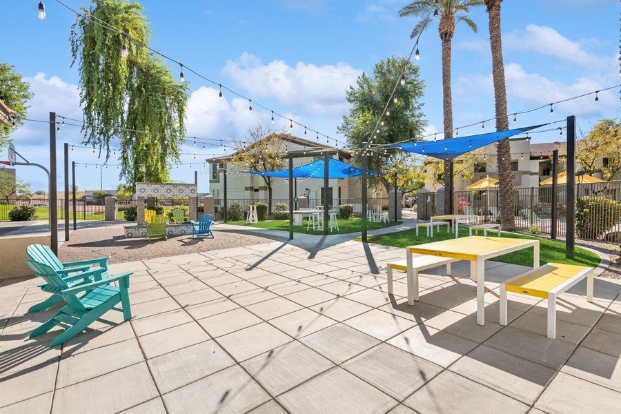 a large patio with picnic tables and chairs at Biscayne Bay