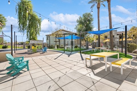 a large patio with picnic tables and chairs at Biscayne Bay